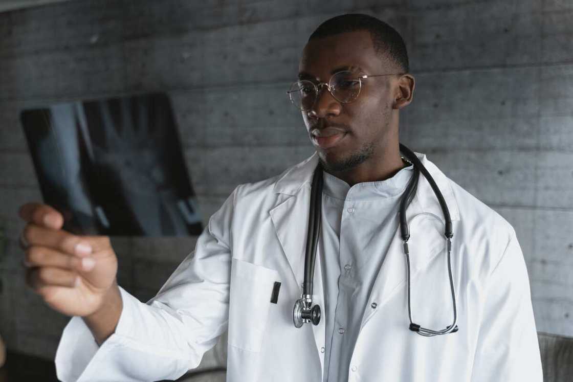 A university student holding RTG picture