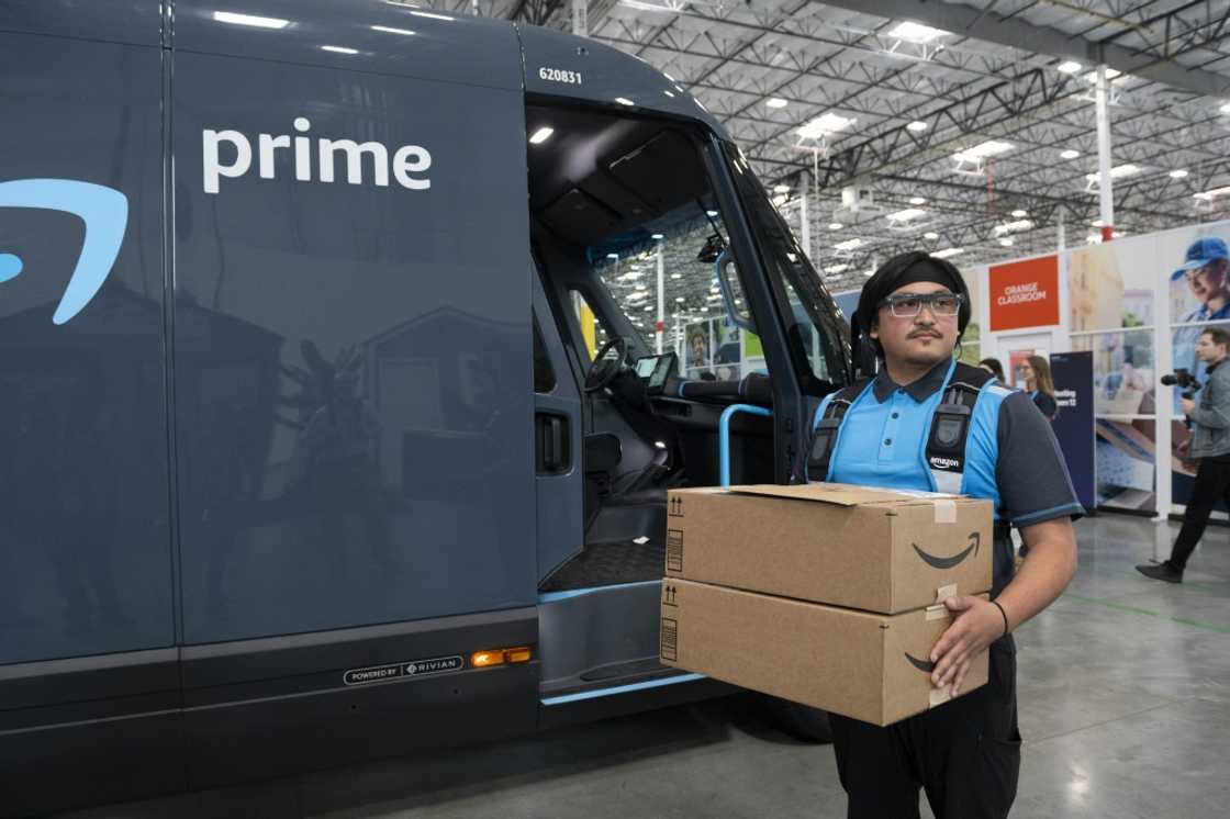 An Amazon delivery driver wears smart glasses displaying real-time navigation and delivery instructions directly in his field of vision, during Amazon's "Delivering the Future" event at a Silicon Valley distribution center An Amazon delivery driver wears smart glasses displaying real-time navigation and delivery instructions directly in his field of vision, during Amazon's "Delivering the Future" event at a Silicon Valley distribution center
