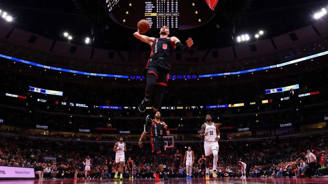 Zach LaVine of the Chicago Bulls jumps high for a dunk (Black). Zach LaVine of the Chicago Bulls jumps high for a dunk (Black).