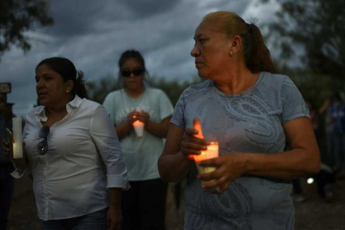 Friends and relatives hold a candlelit vigil for 10 trapped Mexican miners Friends and relatives hold a candlelit vigil for 10 trapped Mexican miners
