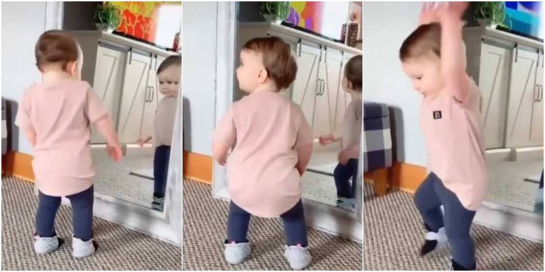 Baby gets tired of boredom, looks into the mirror and dances effortlessly Baby gets tired of boredom, looks into the mirror and dances effortlessly