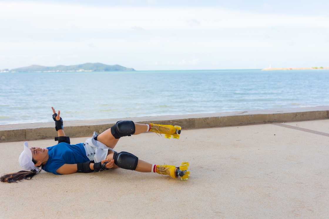 A female get accident while playing roller skate in the park A female get accident while playing roller skate in the park