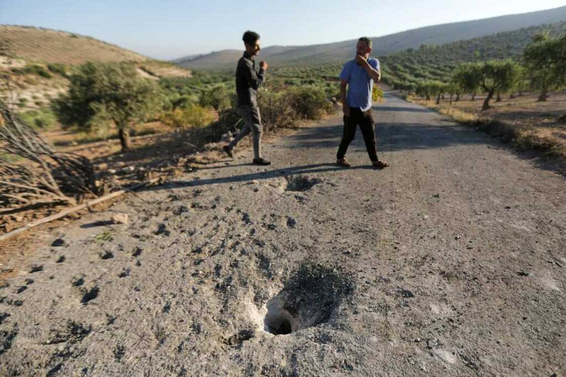People inspect the site where a US drone targeted killed Maher al-Agal, a leader in the Islamic State militant group near Jindires in northern Syria. People inspect the site where a US drone targeted killed Maher al-Agal, a leader in the Islamic State militant group near Jindires in northern Syria.