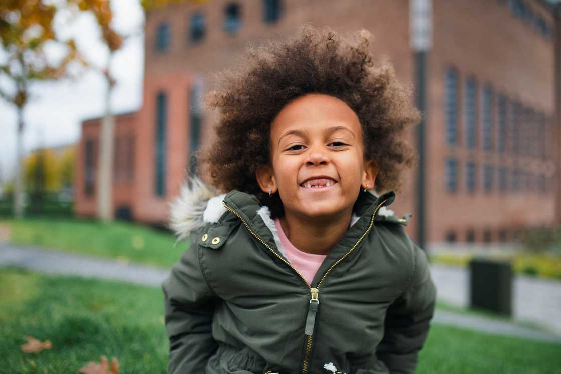 A cheerful girl showing her teeth gap