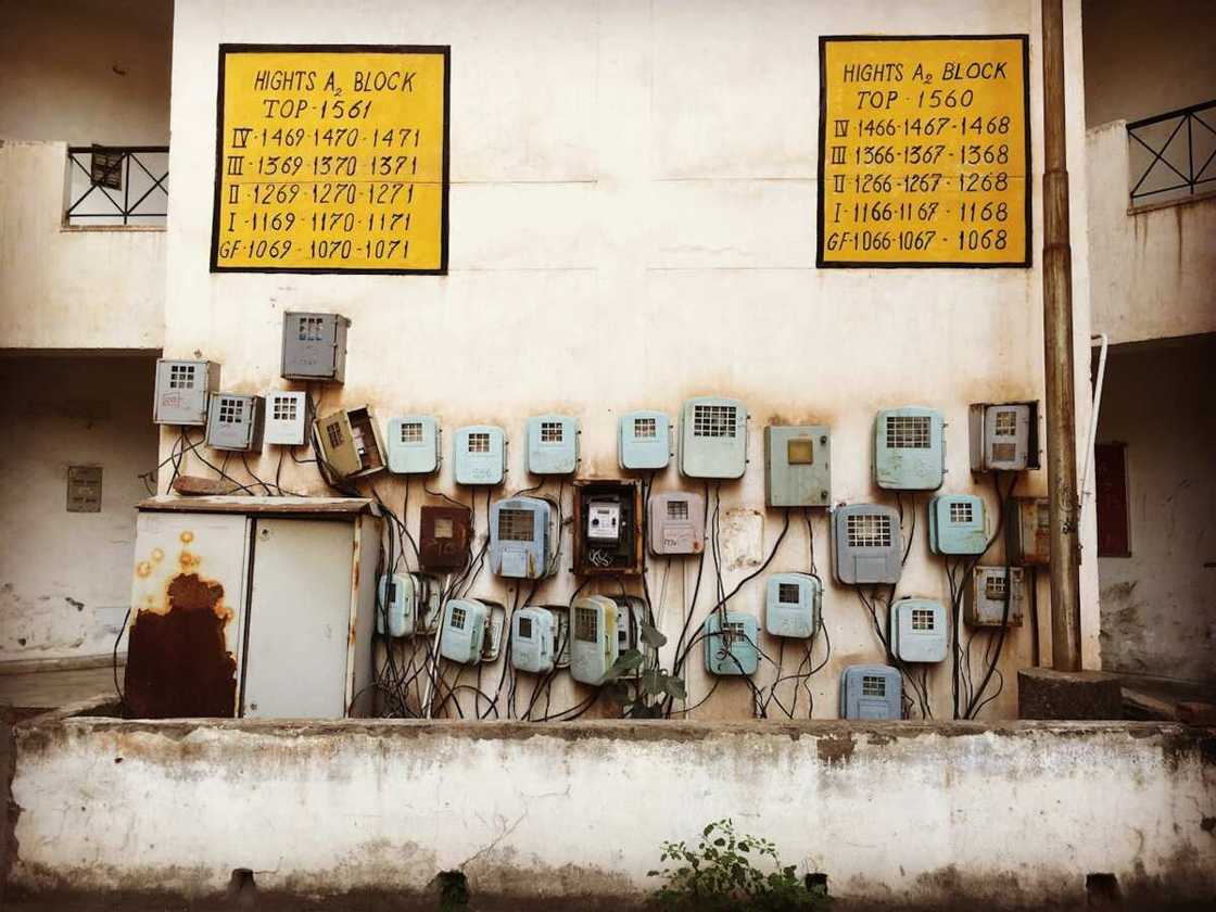 Meter boxes on a wall of an old building