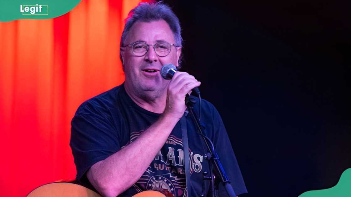 Vince Gill performs onstage during an event Vince Gill performs onstage during an event