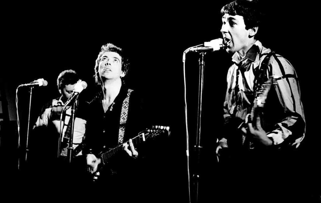 Garth Smith (L), Pete Shelley (C), and Steve Diggle (R) of The Buzzcocks performing