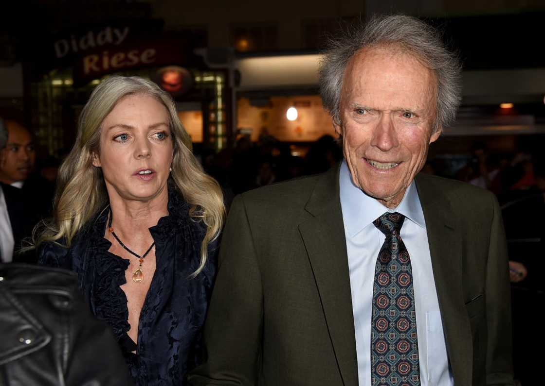 Christina Sandera (L) and Clint Eastwood (R) walking into the Village Theatre Christina Sandera (L) and Clint Eastwood (R) walking into the Village Theatre