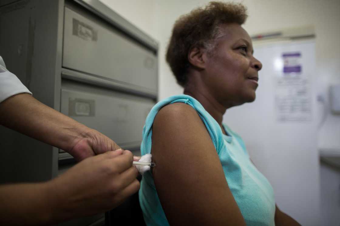 A woman receives vaccination against Yellow Fever A woman receives vaccination against Yellow Fever