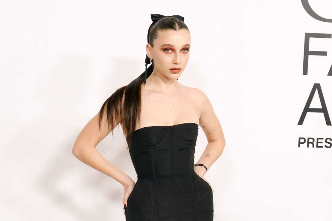 Emma Chamberlain poses in a black dress at the 2023 CFDA Awards