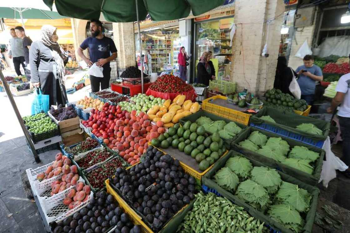 Iranians buy fresh produce at the Tajrish Bazaar market in Tehran. Inflation is making an unwelcome comeback globally -- stoked by high energy and food prices, driven largely by Russia's invasion of Ukraine, and by related sanctions on Moscow Iranians buy fresh produce at the Tajrish Bazaar market in Tehran. Inflation is making an unwelcome comeback globally -- stoked by high energy and food prices, driven largely by Russia's invasion of Ukraine, and by related sanctions on Moscow