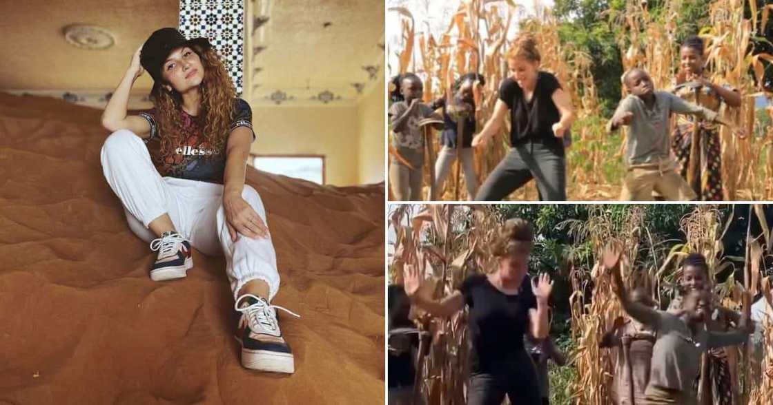 Oyinbo lady dances hard with little orphan boy in adorable video Oyinbo lady dances hard with little orphan boy in adorable video