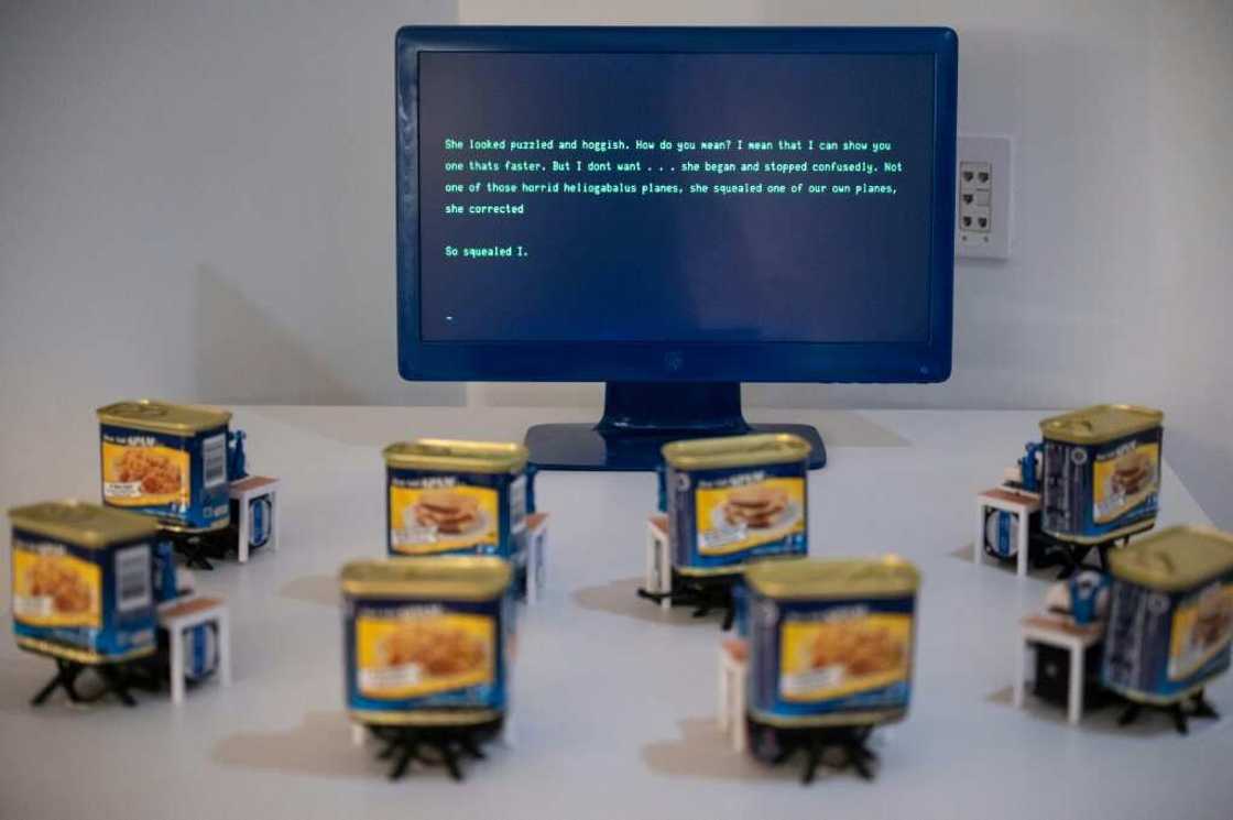 In this exhibit, AI disburses pithy observations to the visitors that cross into its line of vision In this exhibit, AI disburses pithy observations to the visitors that cross into its line of vision