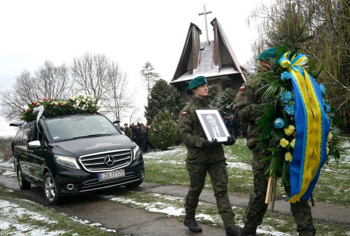 Polish soldiers lead the funeral cortege on Saturday Polish soldiers lead the funeral cortege on Saturday