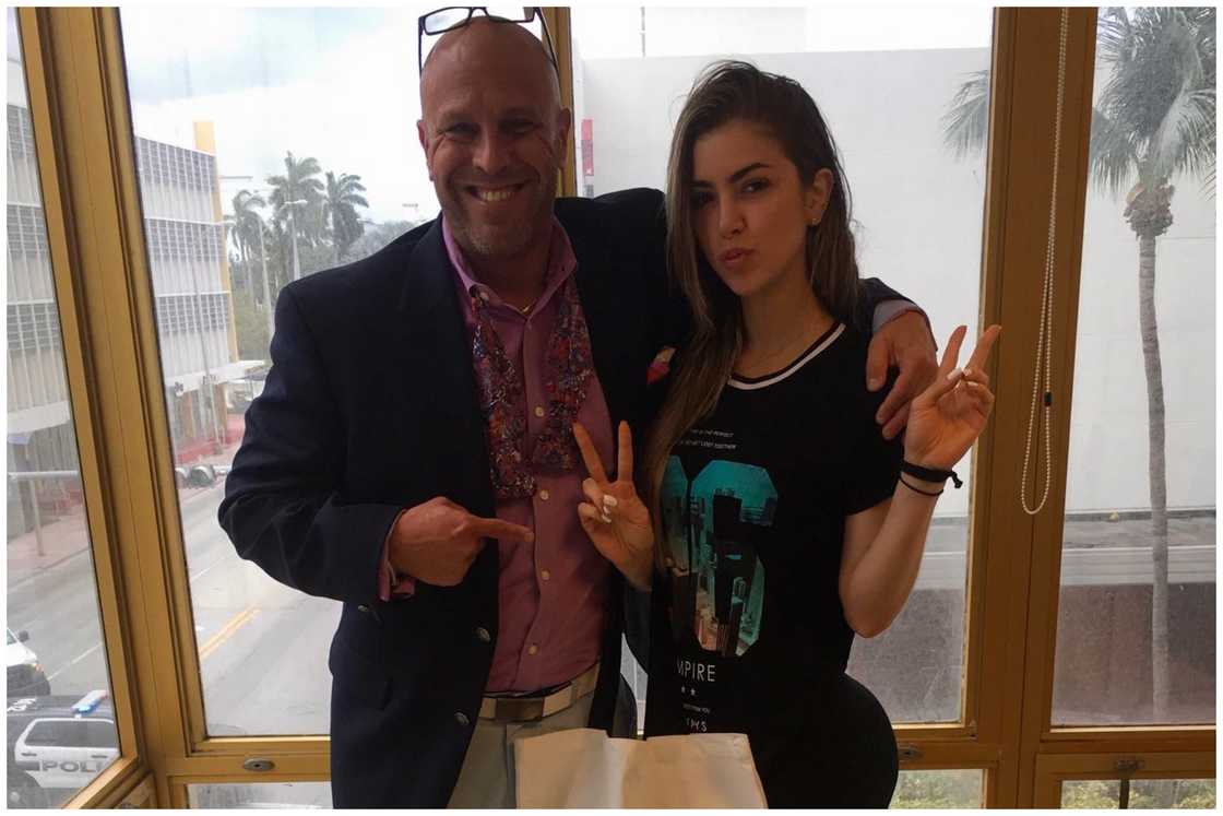 Fitness influencer Anllela Sagra (R) poses for a picture alongside Joshua P, founder at Bratter PA: Immigration Law Firm