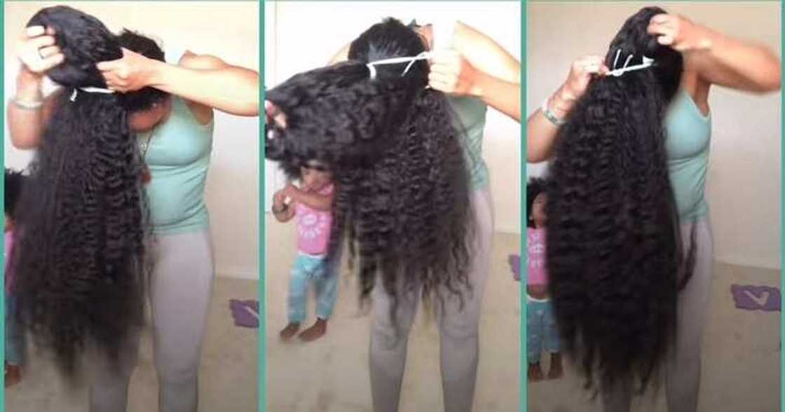 Lady shows off her long natural hair Lady shows off her long natural hair