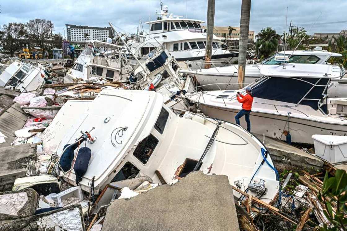 Fox Weather Correspondent Robert Ray takes photos of boats damaged by Hurricane Ian in Fort Myers, Florida, on September 29, 2022 Fox Weather Correspondent Robert Ray takes photos of boats damaged by Hurricane Ian in Fort Myers, Florida, on September 29, 2022