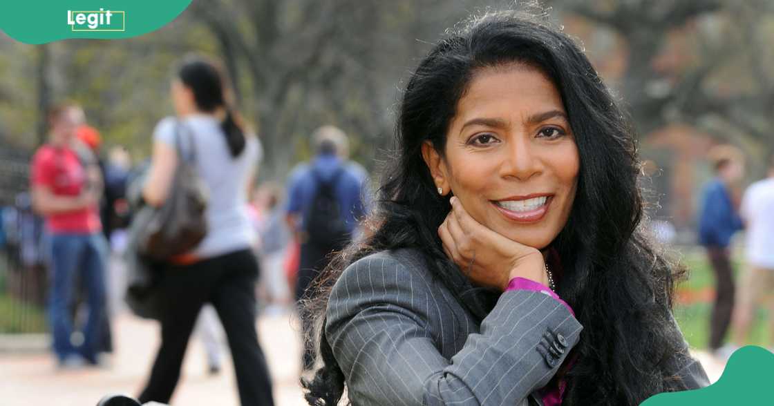 Judy Smith poses sitting