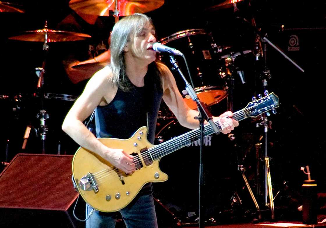 Malcolm Young performs at an event