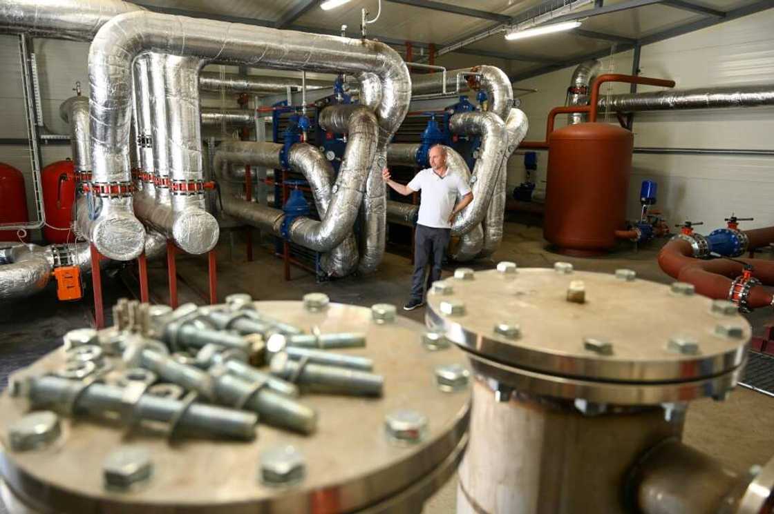 Underground water near the boiling point brought to the surface to heat water running though municipal heating pipes to buildings Underground water near the boiling point brought to the surface to heat water running though municipal heating pipes to buildings