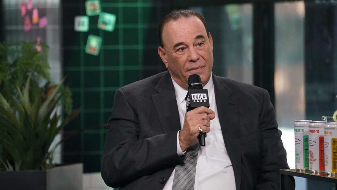 Jon Taffer speaks into a microphone during an episode of the Build Series