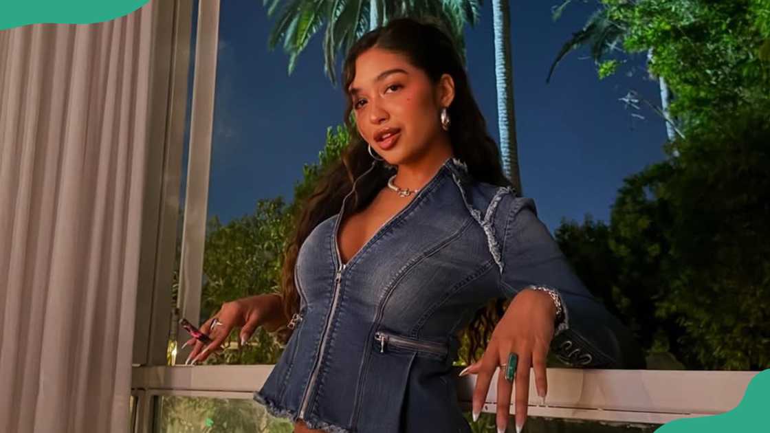 Cierra Ortega relaxes at a house's balcony