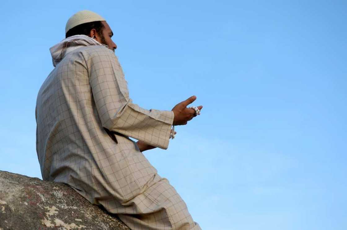 A Muslim pilgrim prays at Jabal al-Noor 'mountain of light' in Mecca. Temperatures in the holy city topped 40 degrees Celsius (104 degrees Fahrenheit) on Tuesday A Muslim pilgrim prays at Jabal al-Noor 'mountain of light' in Mecca. Temperatures in the holy city topped 40 degrees Celsius (104 degrees Fahrenheit) on Tuesday