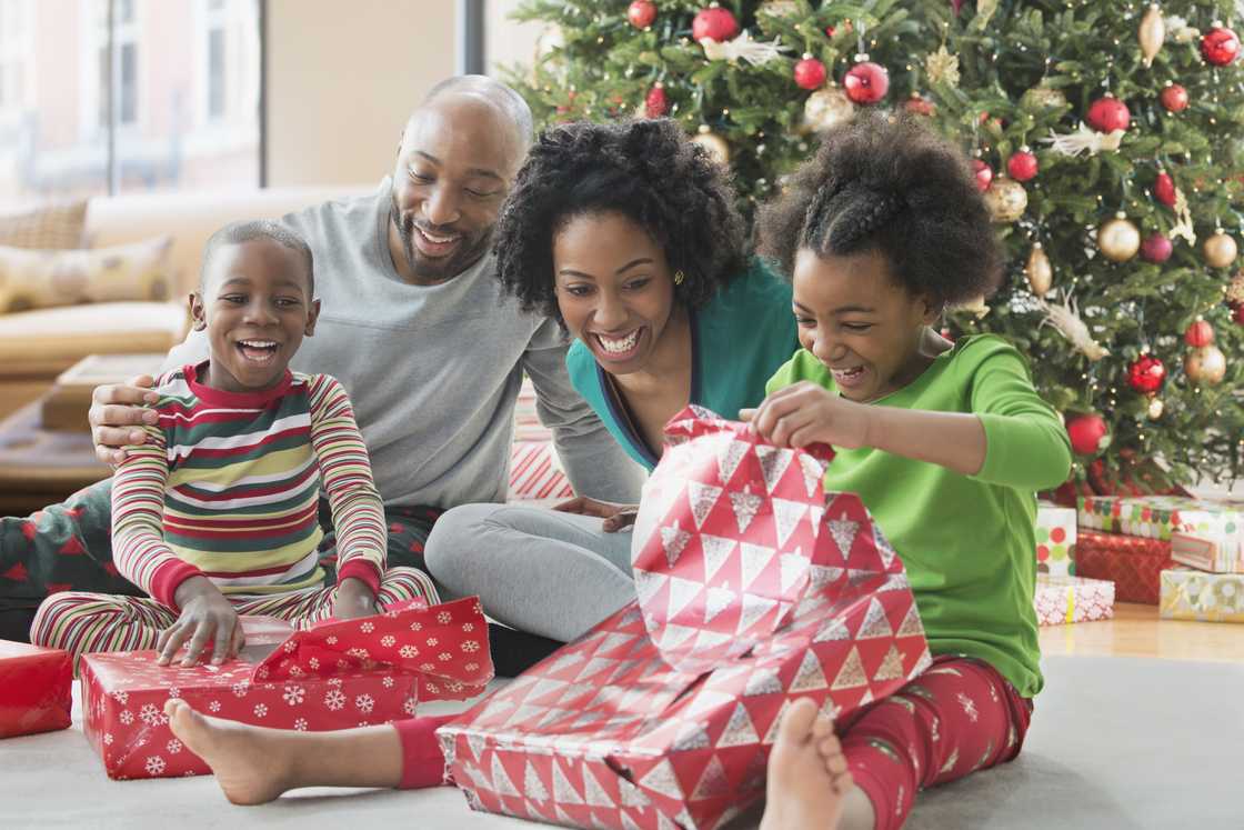 Family opening Christmas presents Family opening Christmas presents