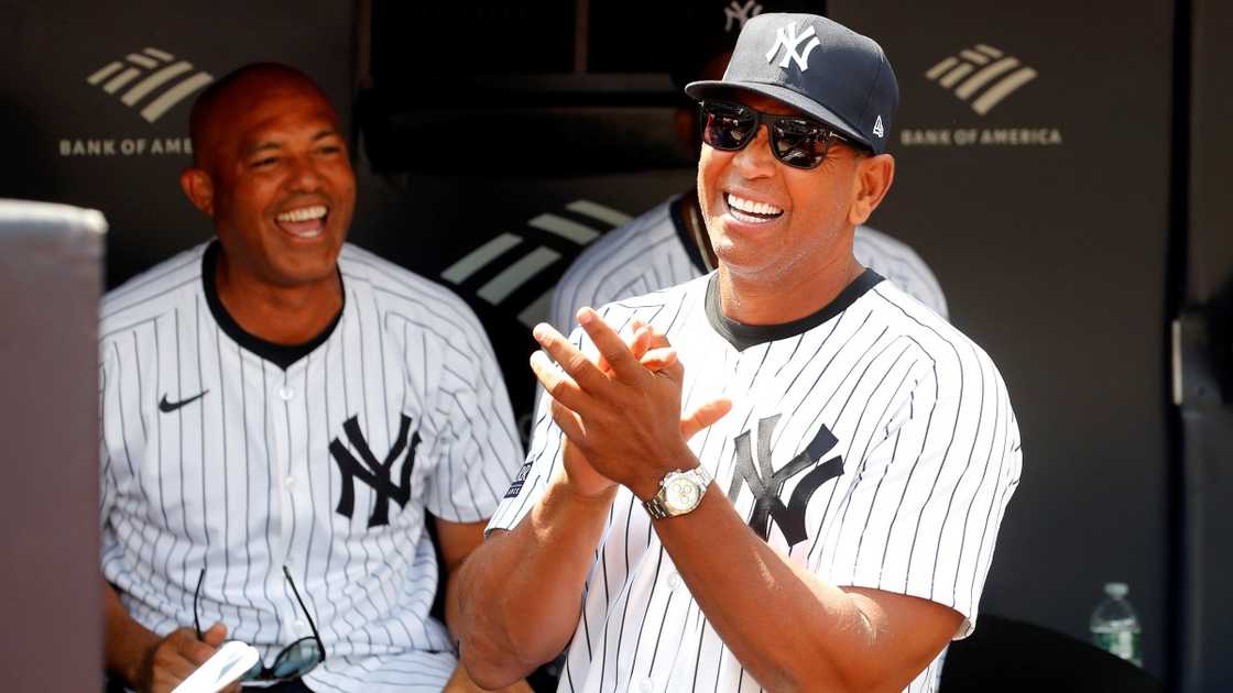 Former New York Yankee Alex Rodriguez claps before a game at Yankee Stadium.