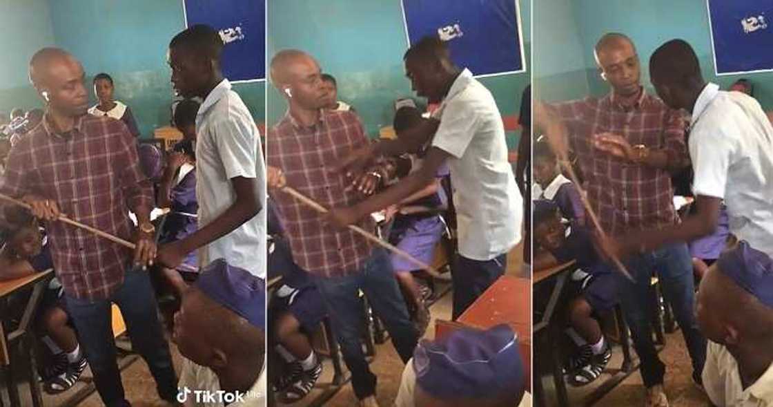 Male student drags cane with teacher In school