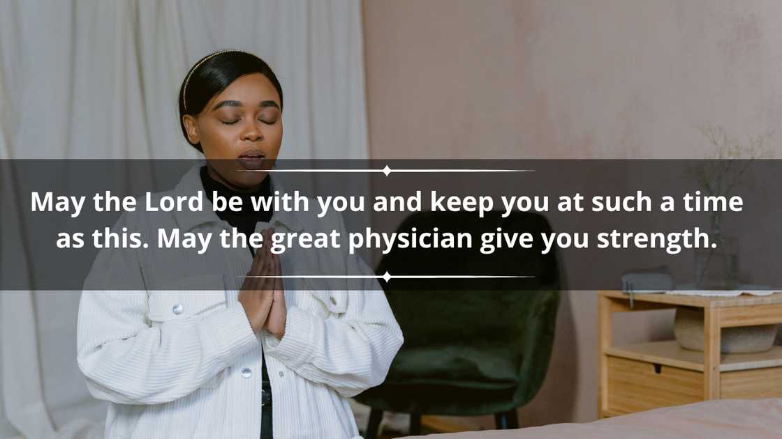 A woman in a white jacket praying
