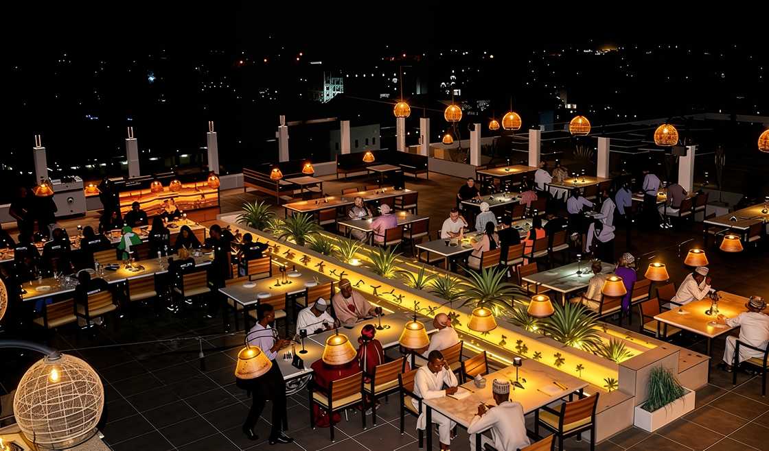 Guests enjoy meals at the Cálido Rooftop's panoramic dining area.