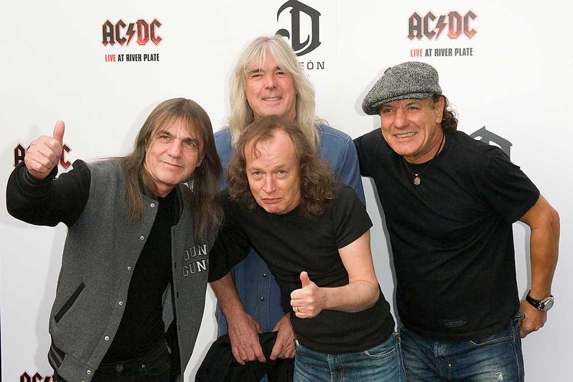 AC/DC band members Malcolm Young, Cliff Williams, Angus Young and Brian Johnson at the HMV Apolo AC/DC band members Malcolm Young, Cliff Williams, Angus Young and Brian Johnson at the HMV Apolo