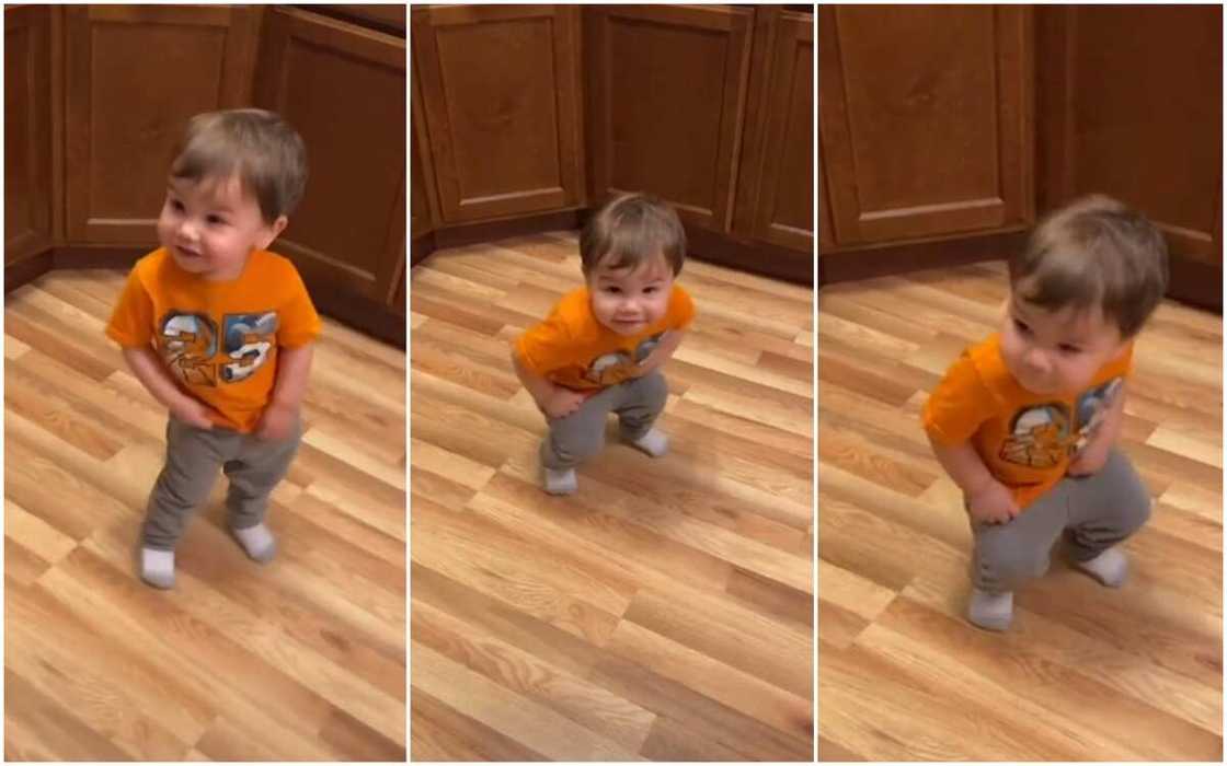 Little baby boy in orange dress uses beautiful dance to distribute joy to his audience