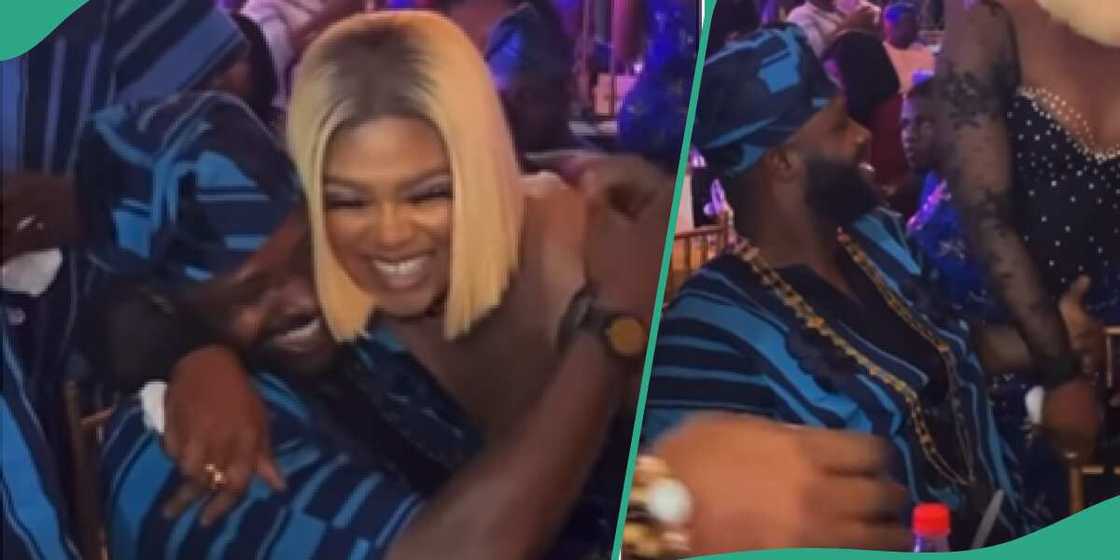 Femi Adebayo appears to collect paper from lady at party. Femi Adebayo appears to collect paper from lady at party.