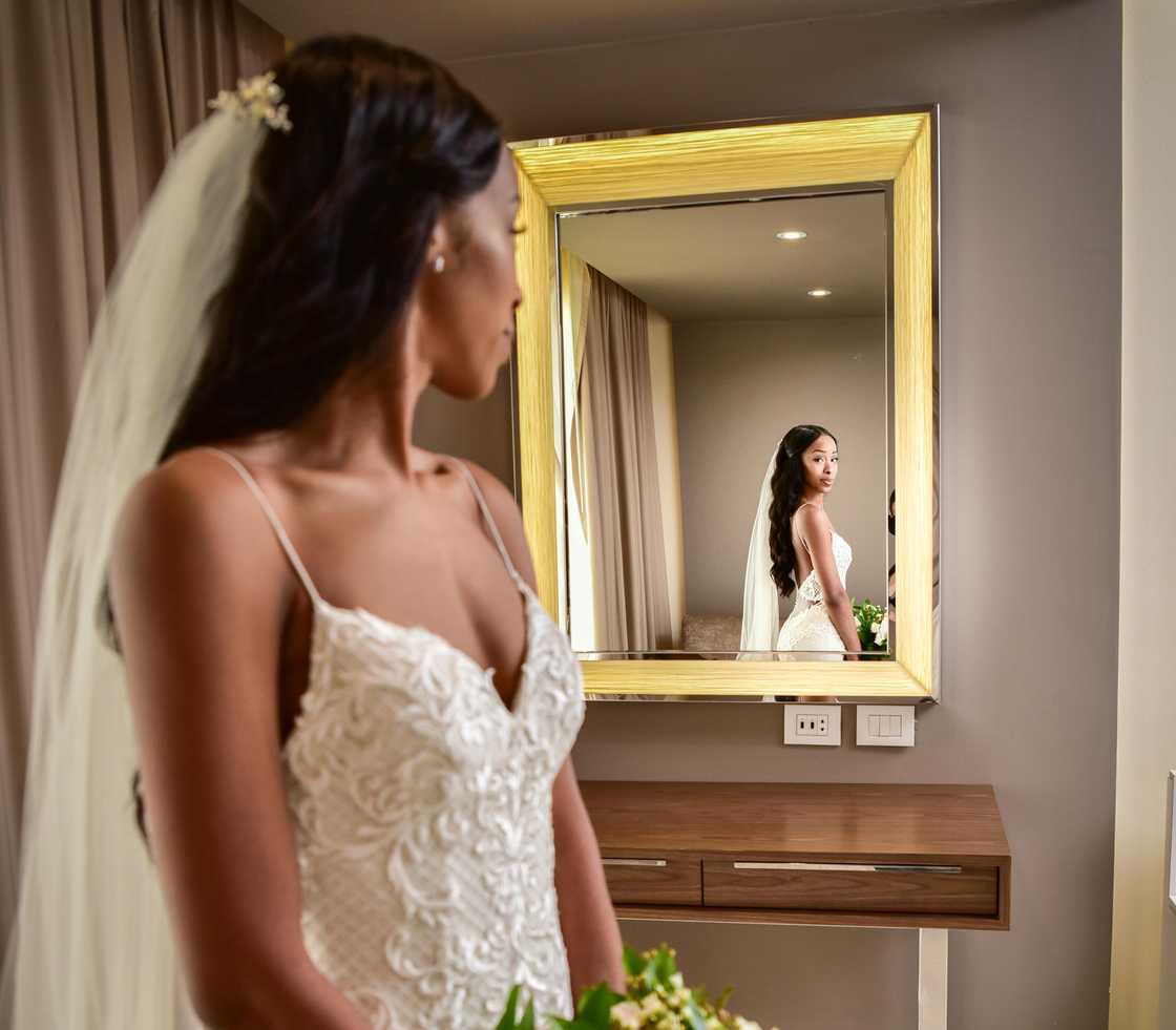 Bride looking at the mirror