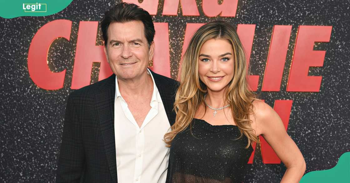Charlie Sheen and Denise Richards pose on the red carpet of the aka Charlie Sheen premiere