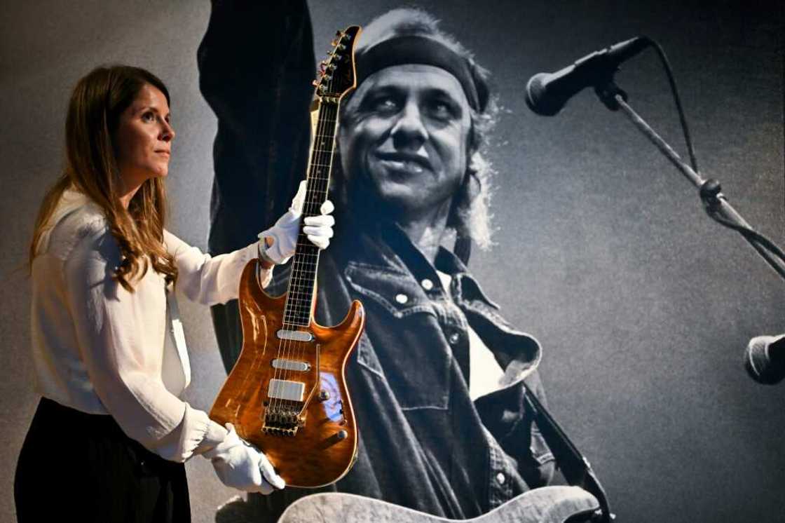 Dire Straits frontman Mark Knopfler put several guitars up for sale at Christie's in London Dire Straits frontman Mark Knopfler put several guitars up for sale at Christie's in London