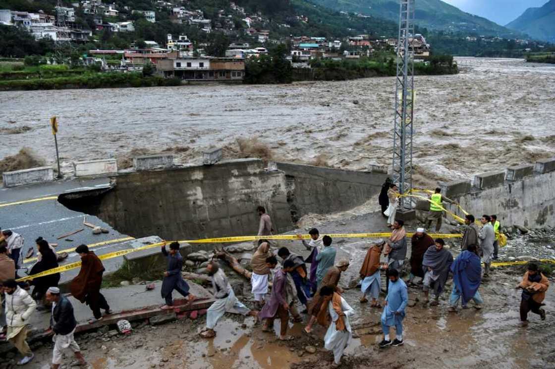 A swollen river in Swat in Pakistan's north destroyed a road running along its banks A swollen river in Swat in Pakistan's north destroyed a road running along its banks