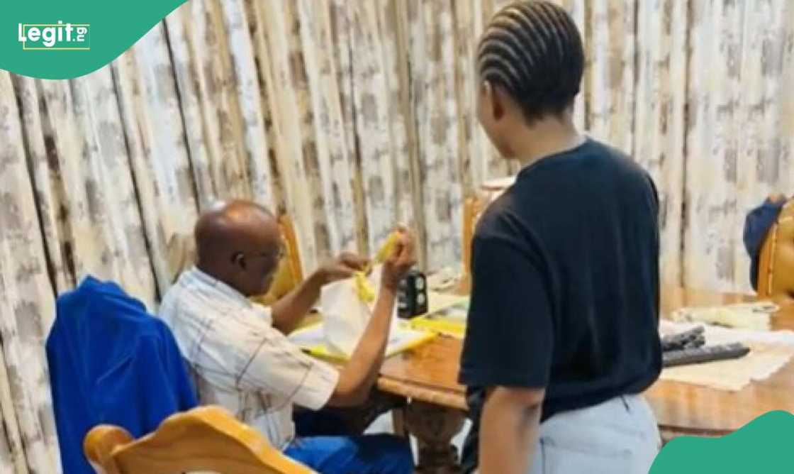 The father was emotional due to the phone gift he received from lady The father was emotional due to the phone gift he received from lady