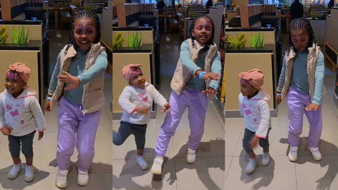 Photo of little girl and her sister dancing