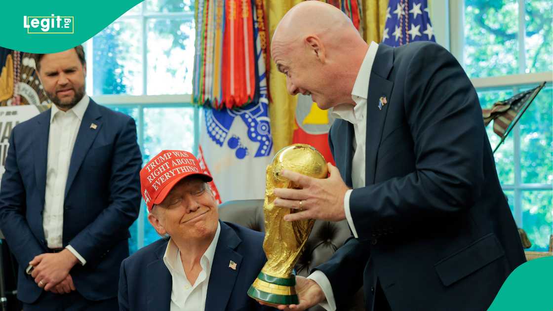 FIFA President Gianni Infantino shows Donald Trump the World Cup Trophy in the Oval Office. Photo by Chip Somodevilla