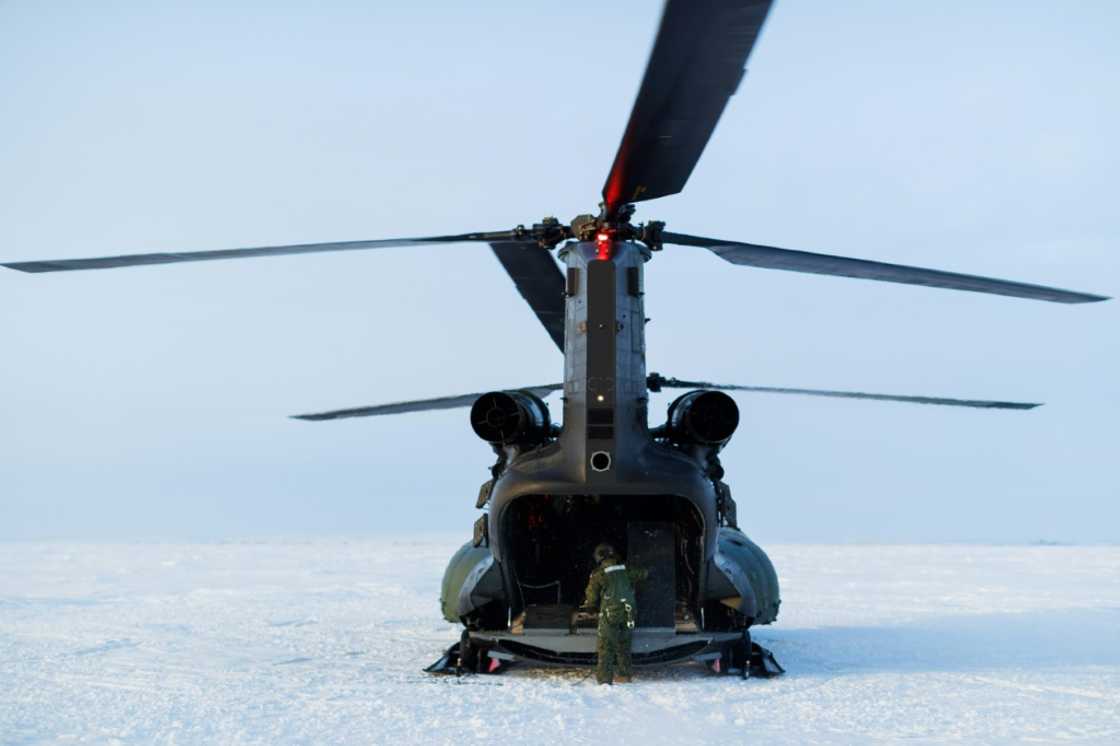 A Canadian military chinook helicopter completes a supply drop to Canadian Rangers on Parsons Lake during Operation Nanook, the Canadian Armed Forces' annual Arctic training and sovereignty operation, near Inuvik, Northwest Territories on March 1