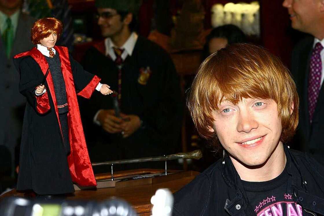 Actor Rupert Grint stands beside a doll depicting his character Ron Weasley Actor Rupert Grint stands beside a doll depicting his character Ron Weasley