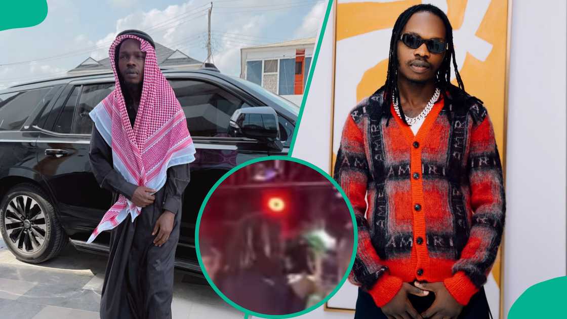 Naira Marley gets attacked by a fan while performing. Naira Marley gets attacked by a fan while performing.