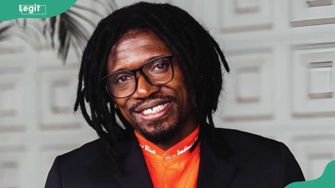 Rapper Sagat smiles as he poses for a solo picture Rapper Sagat smiles as he poses for a solo picture