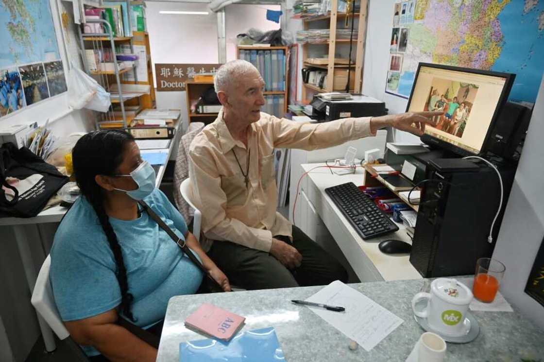 Father John Wotherspoon (R), a Catholic prison chaplain, has spent decades working with drug mules in Hong Kong Father John Wotherspoon (R), a Catholic prison chaplain, has spent decades working with drug mules in Hong Kong