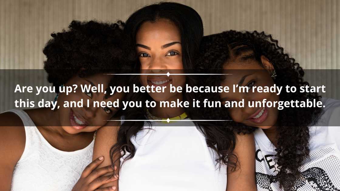 Three Black women in white tops are posing for a picture together