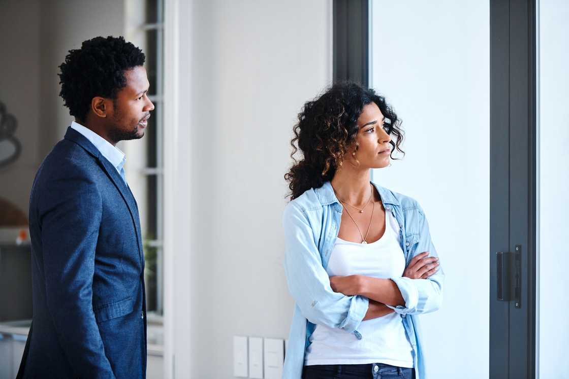 A young married couple having an argument at home
