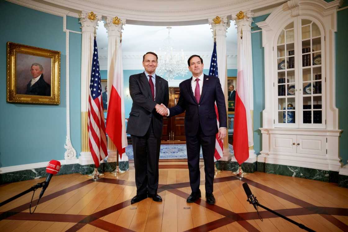 US Secretary of State Marco Rubio (R) greets Polish Foreign Minister Radoslaw Sikorski at the State Department on February 21, 2025, weeks before a US-Polish spat erupted over Elon Musk's Starlink company